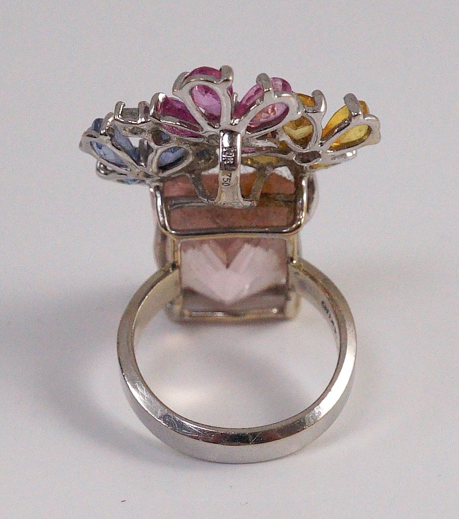 A large modern 14k white gold, morganite, four colour sapphire (including colourless) and diamond chip set triple flower head dress ring, in a raised setting